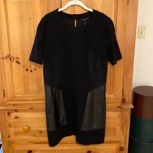 BCBG black A-line dress with vegan leather and suede accents.